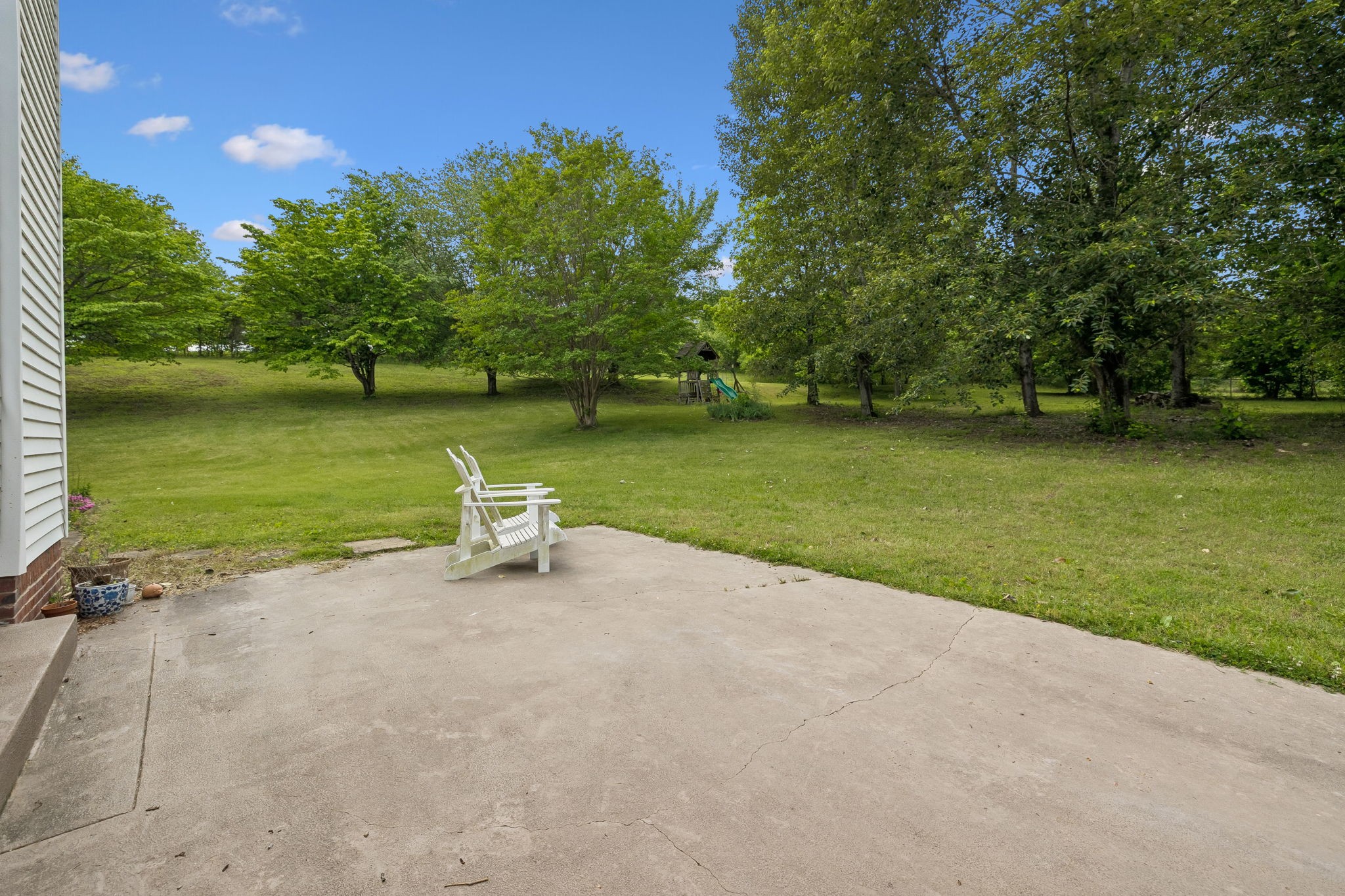 1915 Greenwood Road Charlotte, TN 37036 - Photo 43 of 60 a view of a lake with a bench and trees around