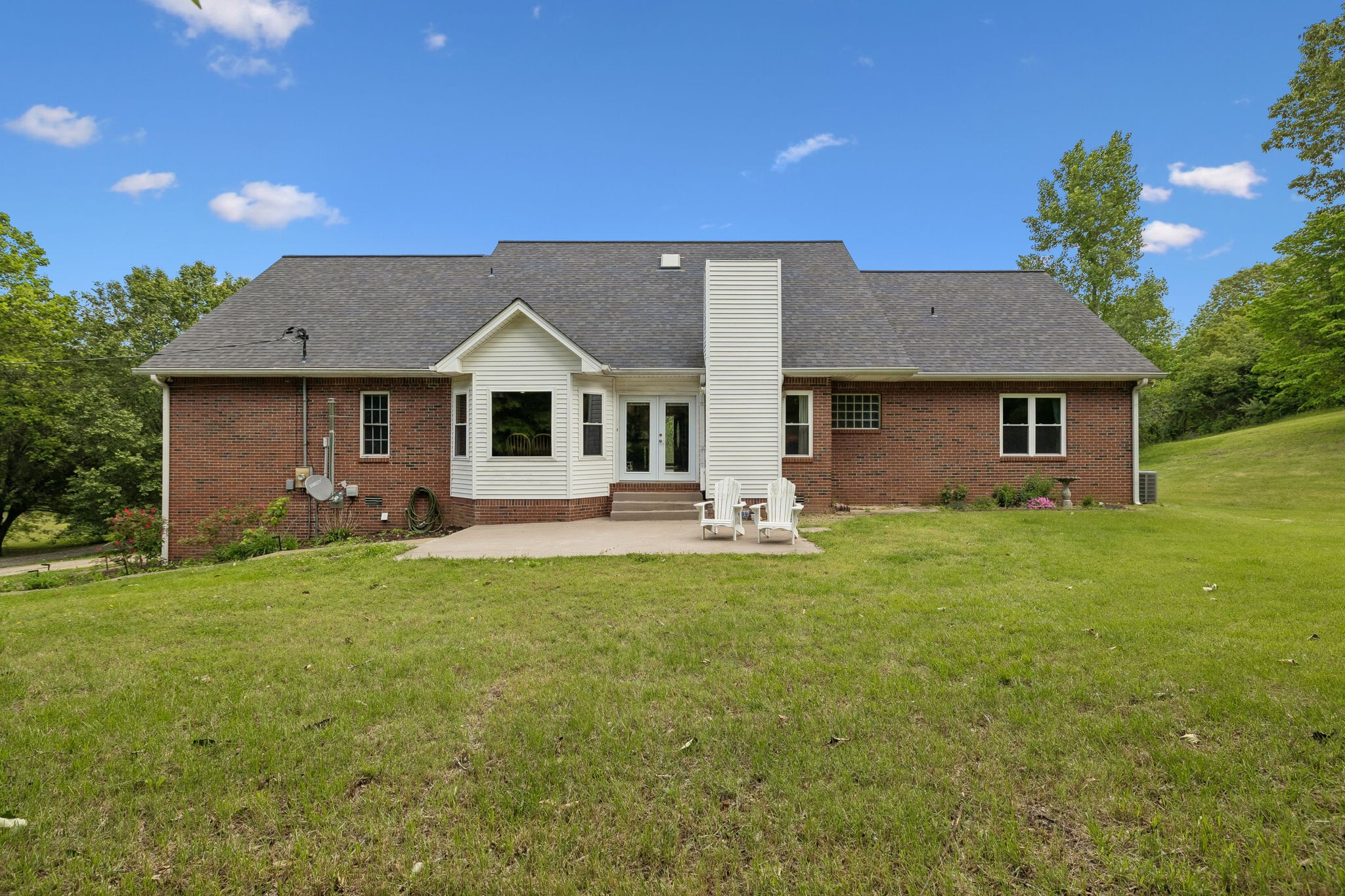 1915 Greenwood Road Charlotte, TN 37036 - Photo 44 of 60 a front view of a house with a garden
