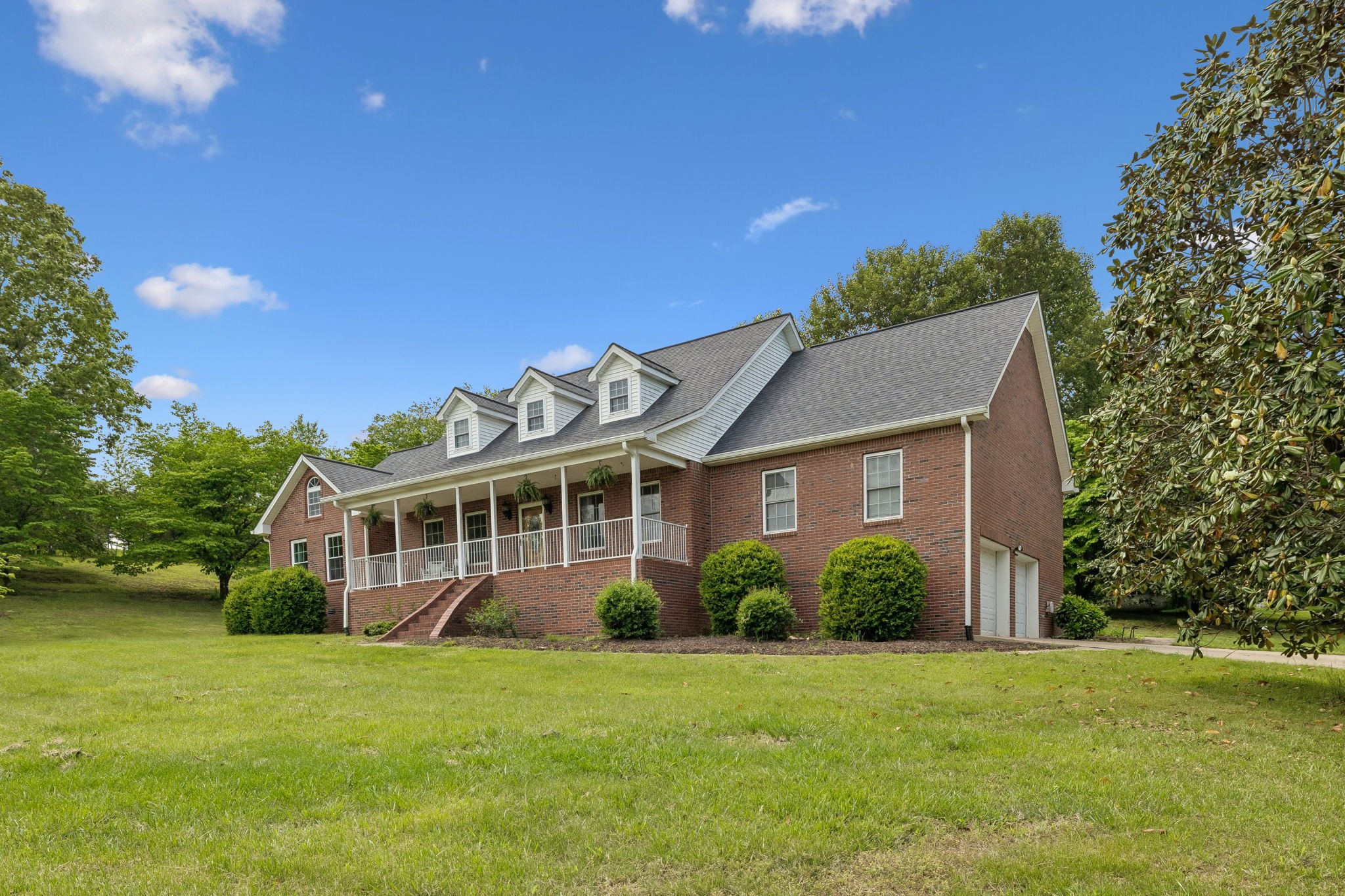 1915 Greenwood Road Charlotte, TN 37036 - Photo 5 of 60 a view of a house with a yard and potted plants
