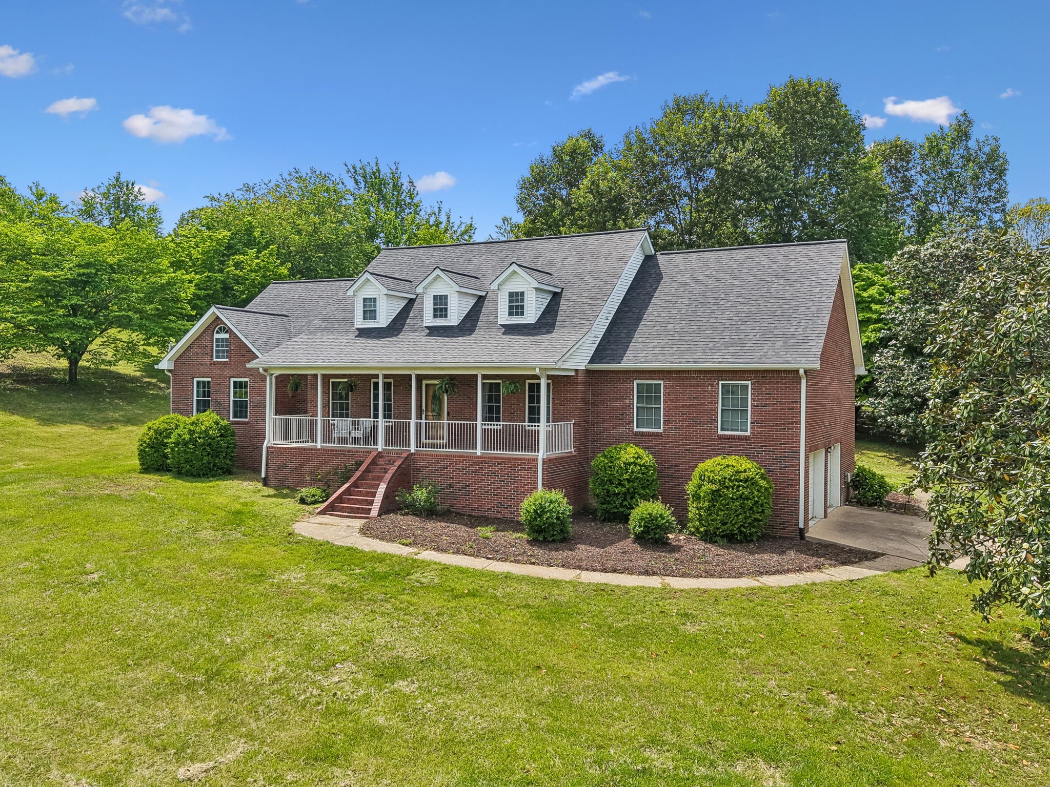 1915 Greenwood Road Charlotte, TN 37036 - Photo 54 of 60 a front view of a house with a yard