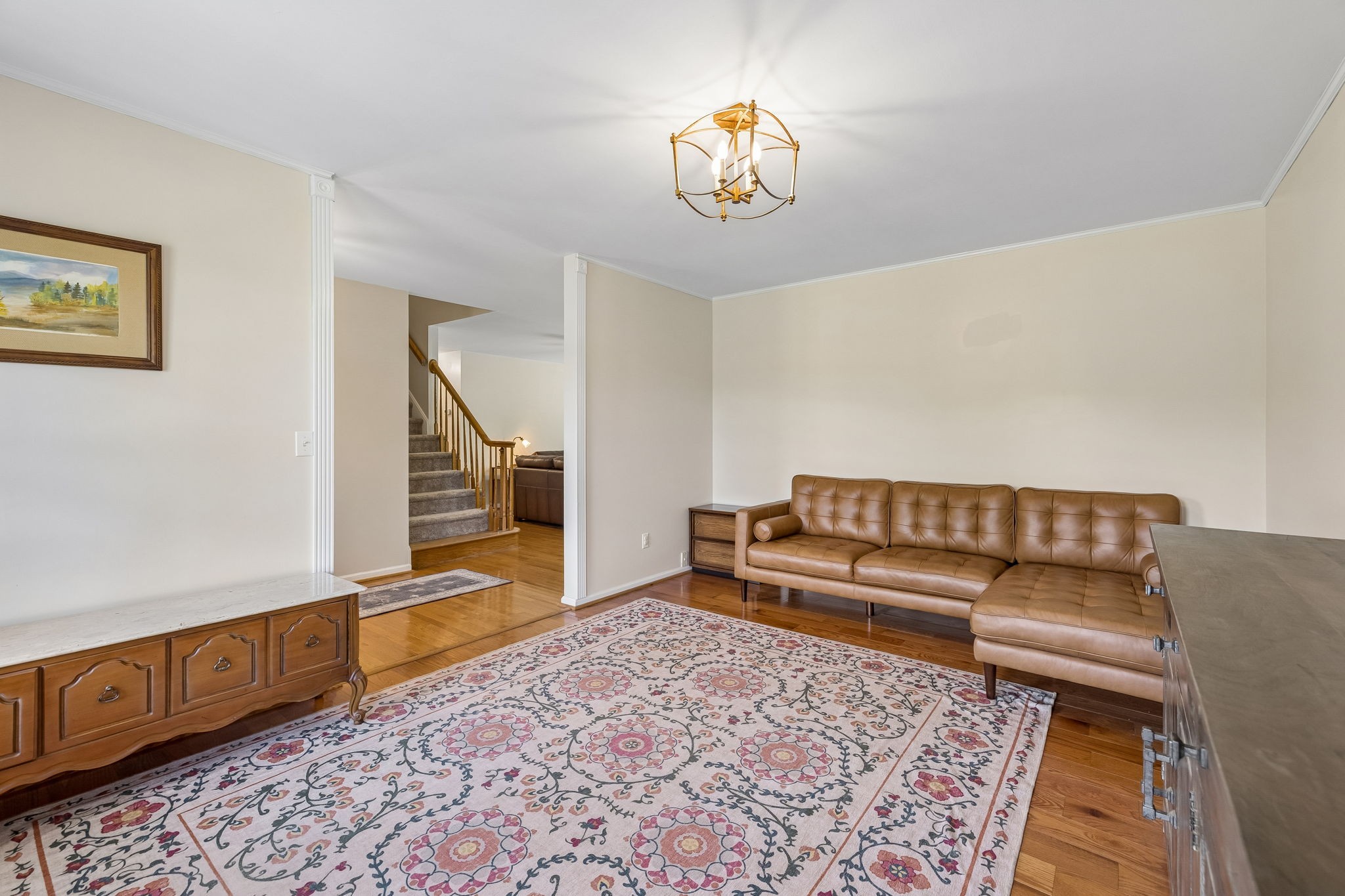 1915 Greenwood Road Charlotte, TN 37036 - Photo 10 of 60 a living room with a couch and a chandelier
