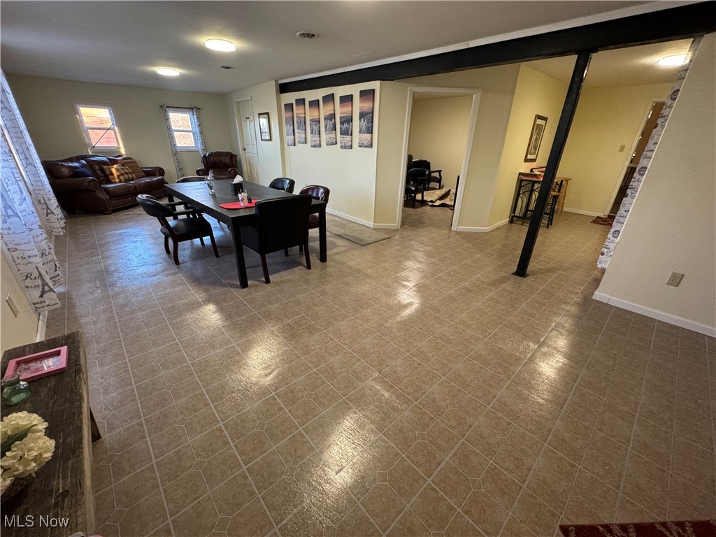 152 East Main Street Barnesville, OH 43713 - Photo 20 of 48 Dining space with baseboards and tile patterned floors