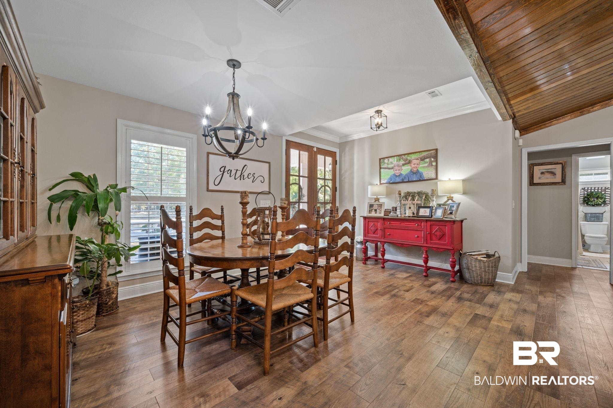 38211-d) V R Byrd Road Bay Minette, AL 36507 - Photo 4 of 58 Dining space with french doors, plenty of natural light, dark hardwood / wood-style floors, and a notable chandelier