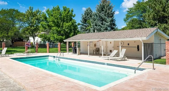 a view of a house with backyard porch and sitting area