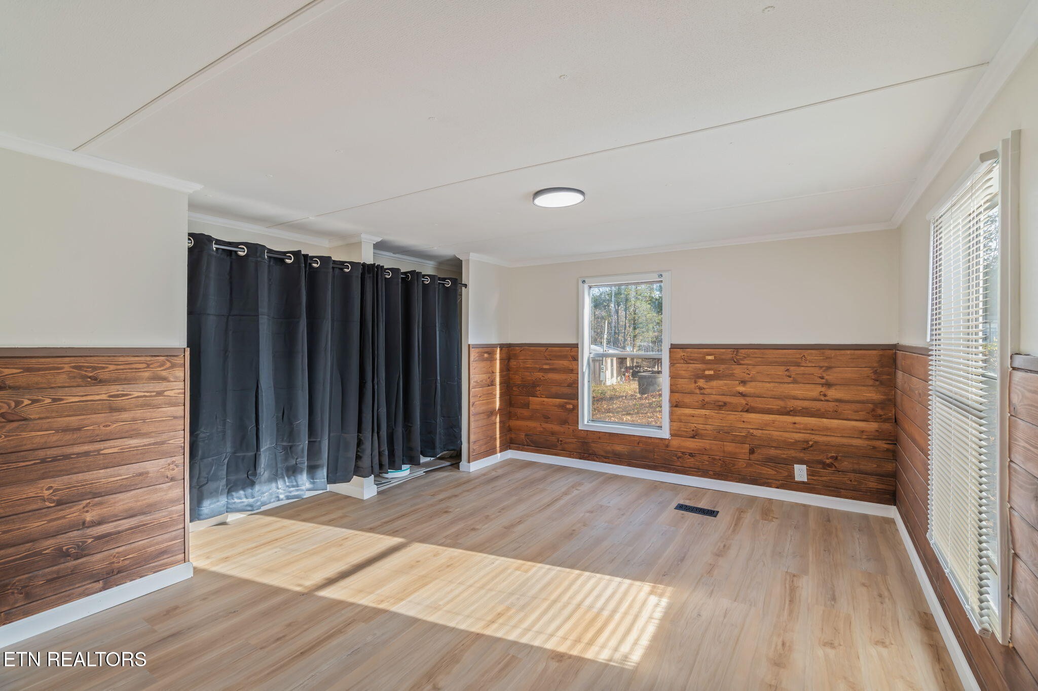 817 Vanessa Way Heiskell, TN 37754 - Photo 12 of 31 a view of an empty room with wooden floor and a window