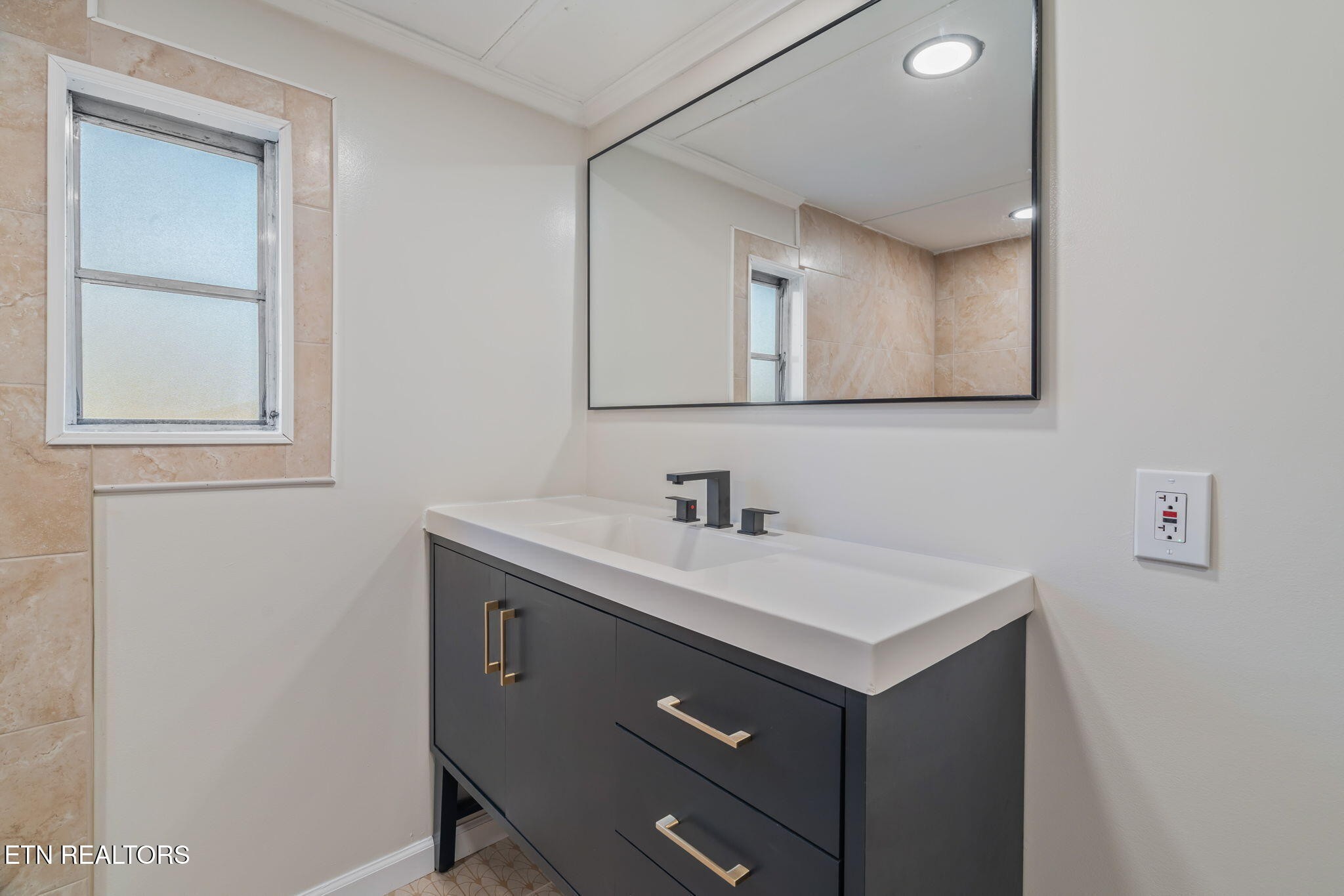 817 Vanessa Way Heiskell, TN 37754 - Photo 14 of 31 a bathroom with a sink vanity and a mirror