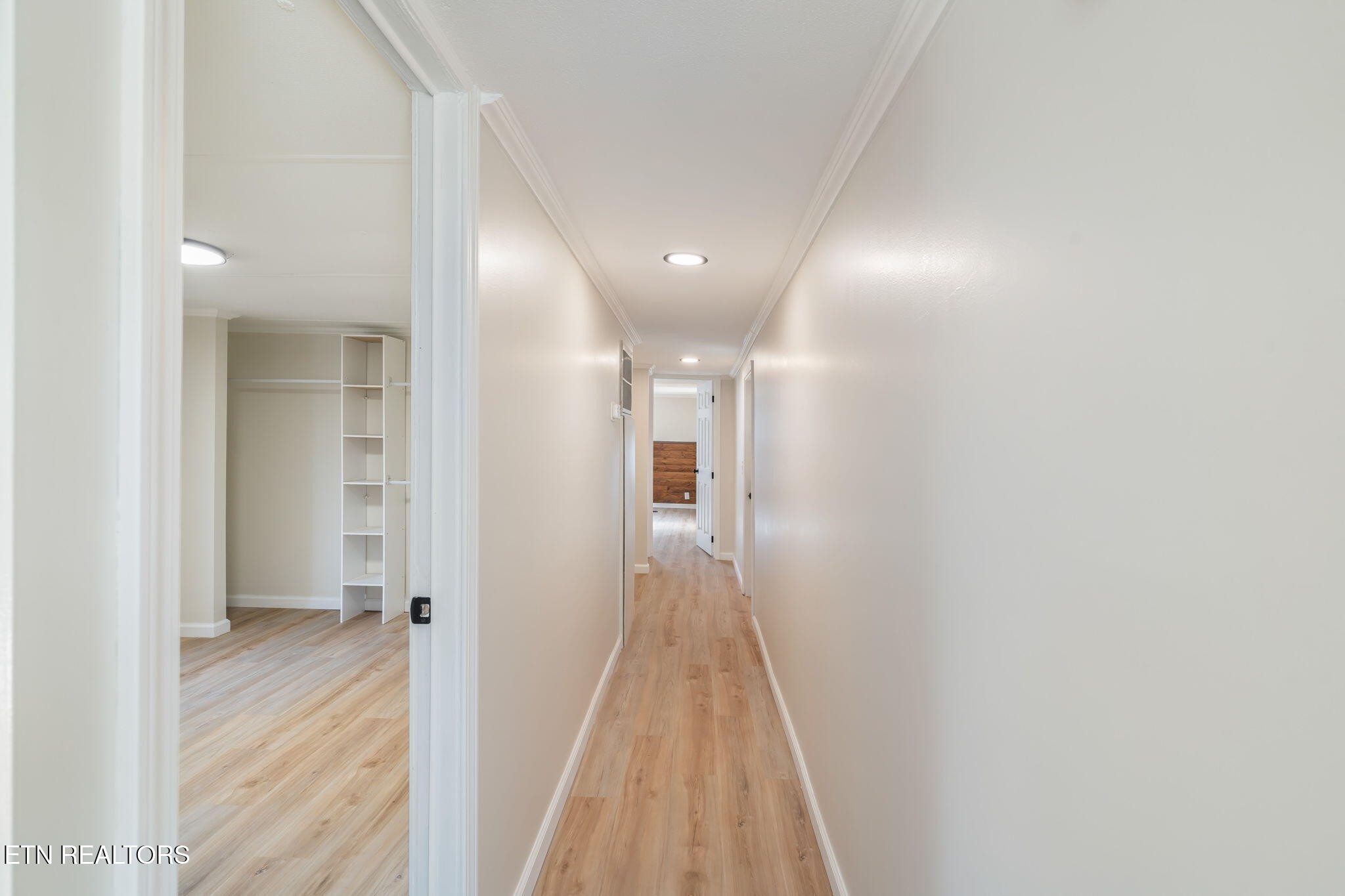 817 Vanessa Way Heiskell, TN 37754 - Photo 20 of 31 a view of a hallway with wooden floor and a bathroom
