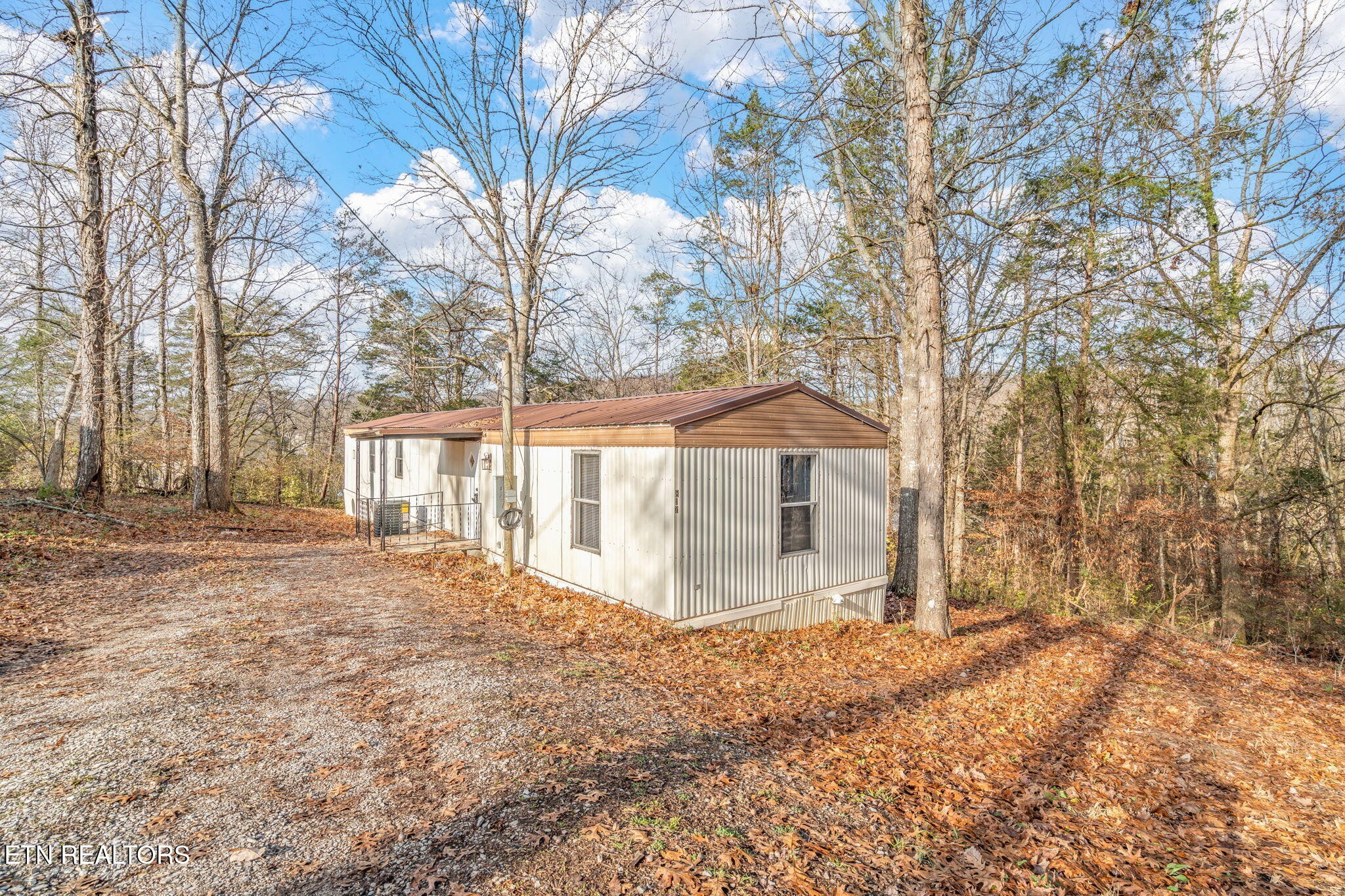 817 Vanessa Way Heiskell, TN 37754 - Photo 22 of 31 a view of a house with a yard covered with snow