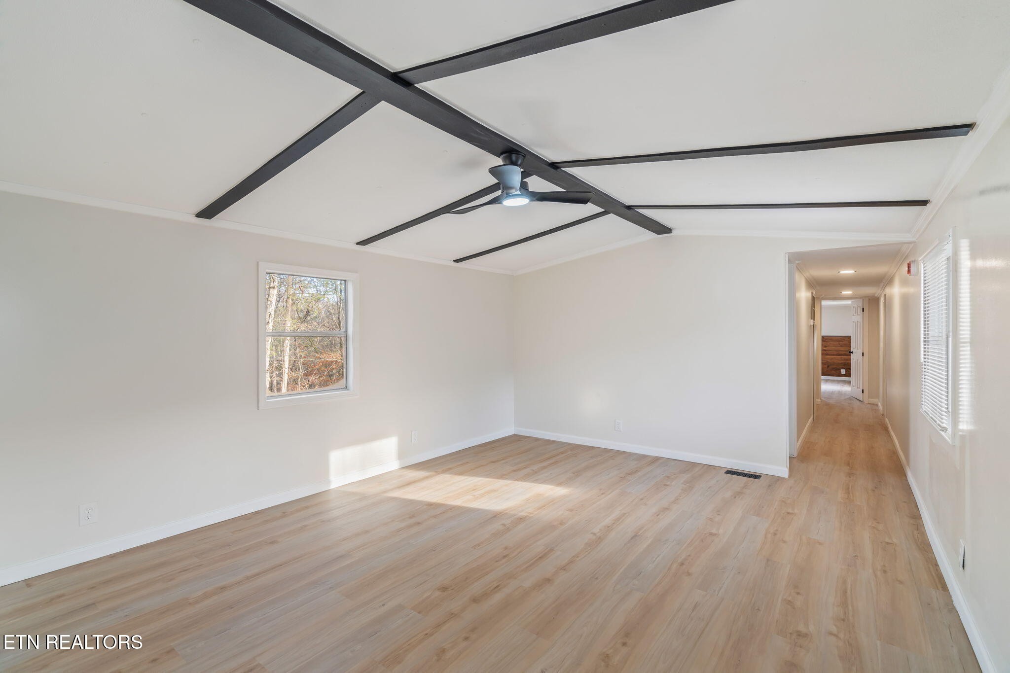 817 Vanessa Way Heiskell, TN 37754 - Photo 7 of 31 a view of an empty room with wooden floor and a window