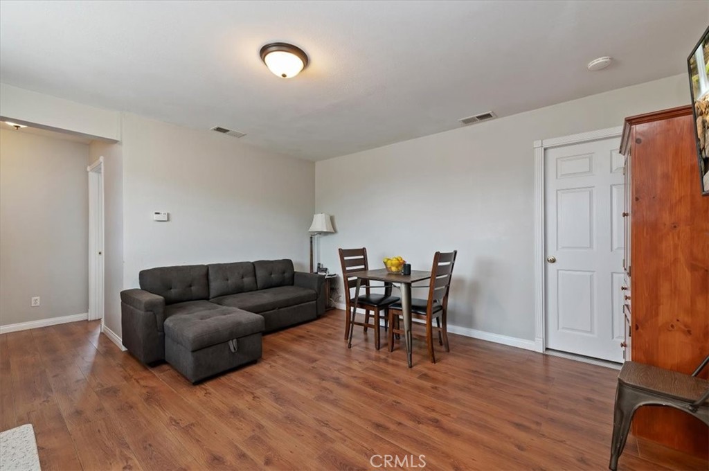 16420 Rocky Glen Road Perris, CA 92570 - Photo 61 of 74 a living room with furniture and a wooden floor