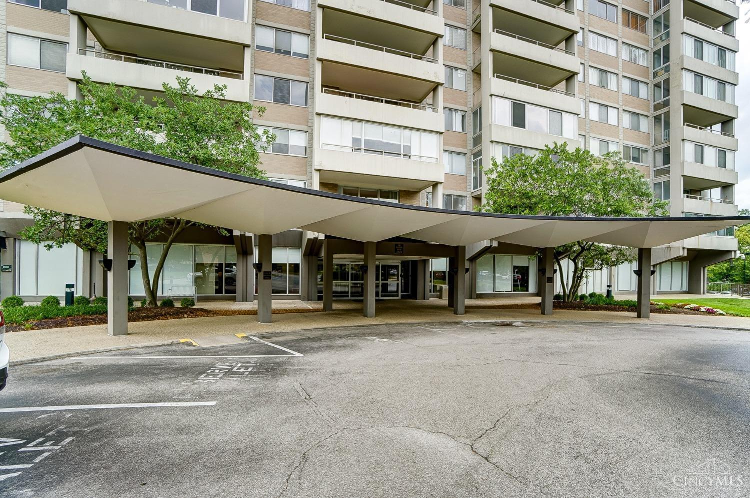 2324 Madison Road, Unit 204 Cincinnati, OH 45208 - Photo 5 of 34 Covered drop off area at entrance. Unit 204 balcony is behind the top of the tree canopy on the left.