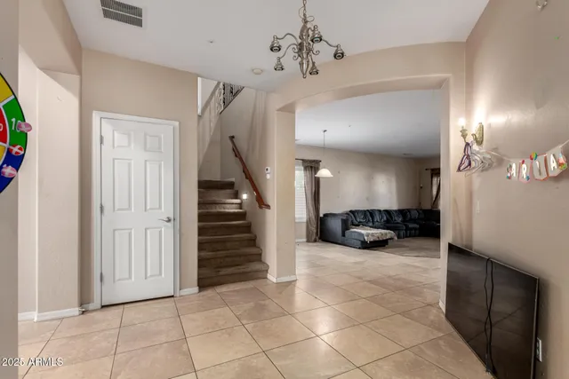 a view of a livingroom with furniture and stairs
