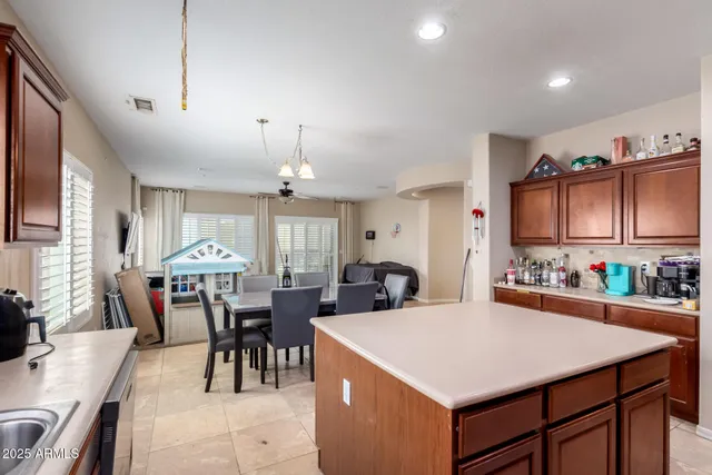 a view of a dining room with furniture and chandelier