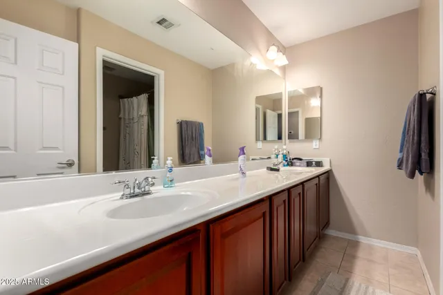 a white toilet sitting next to a shower curtain
