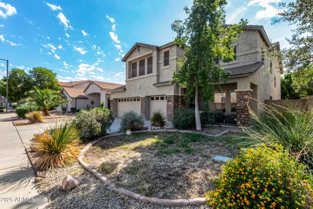 a front view of a house with garden