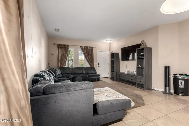 a living room with furniture and a couch