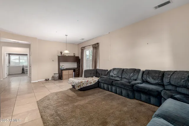 a living room with furniture and a couch