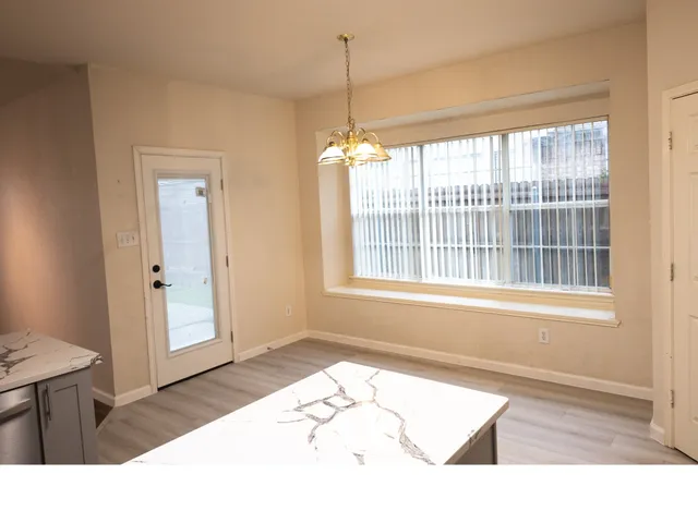 a picture of a living room and a window