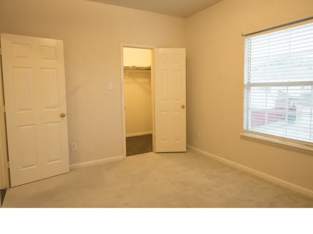 a room with a window and a bathroom