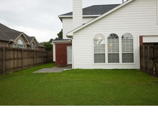 a view of a backyard of the house