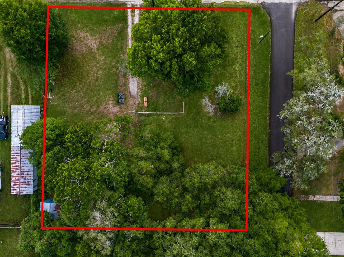 8407 Wilson Street Fulshear, TX 77441 - Photo 7 of 16 From above, the property's prime location is easy to appreciate, featuring excellent visibility, easy access, and dual street frontage that adds exceptional value for residential, commercial, or mixed-use development.