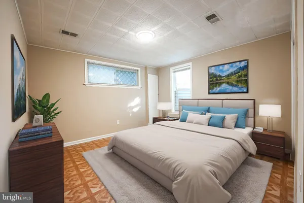 a bedroom with a bed and a painting on the wall