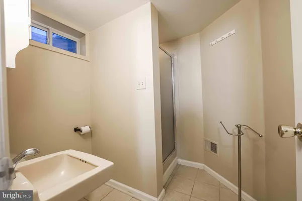 a bathroom with a sink and shower