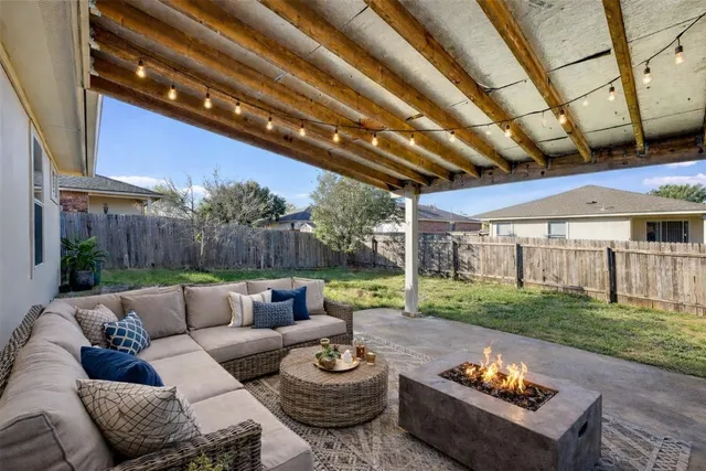 a outdoor living space with patio furniture and a garden