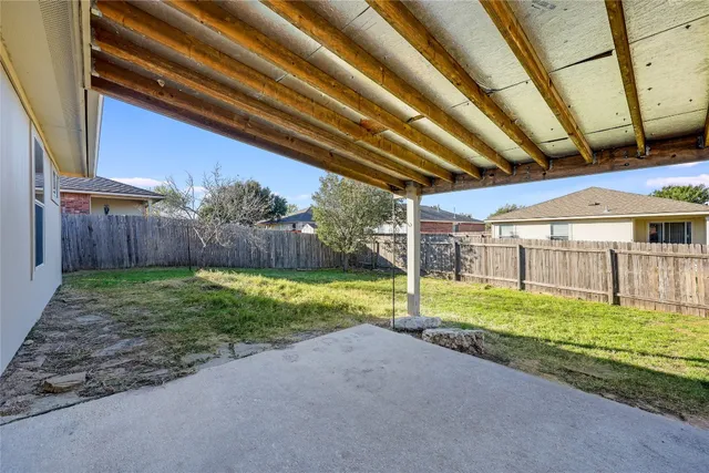 a view of backyard with green space
