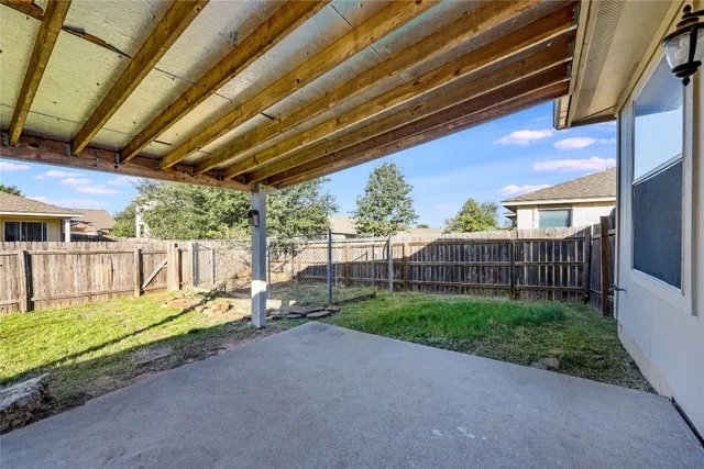 a view of backyard with green space