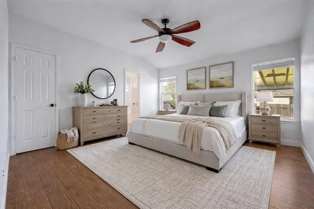 a bedroom with a bed and window