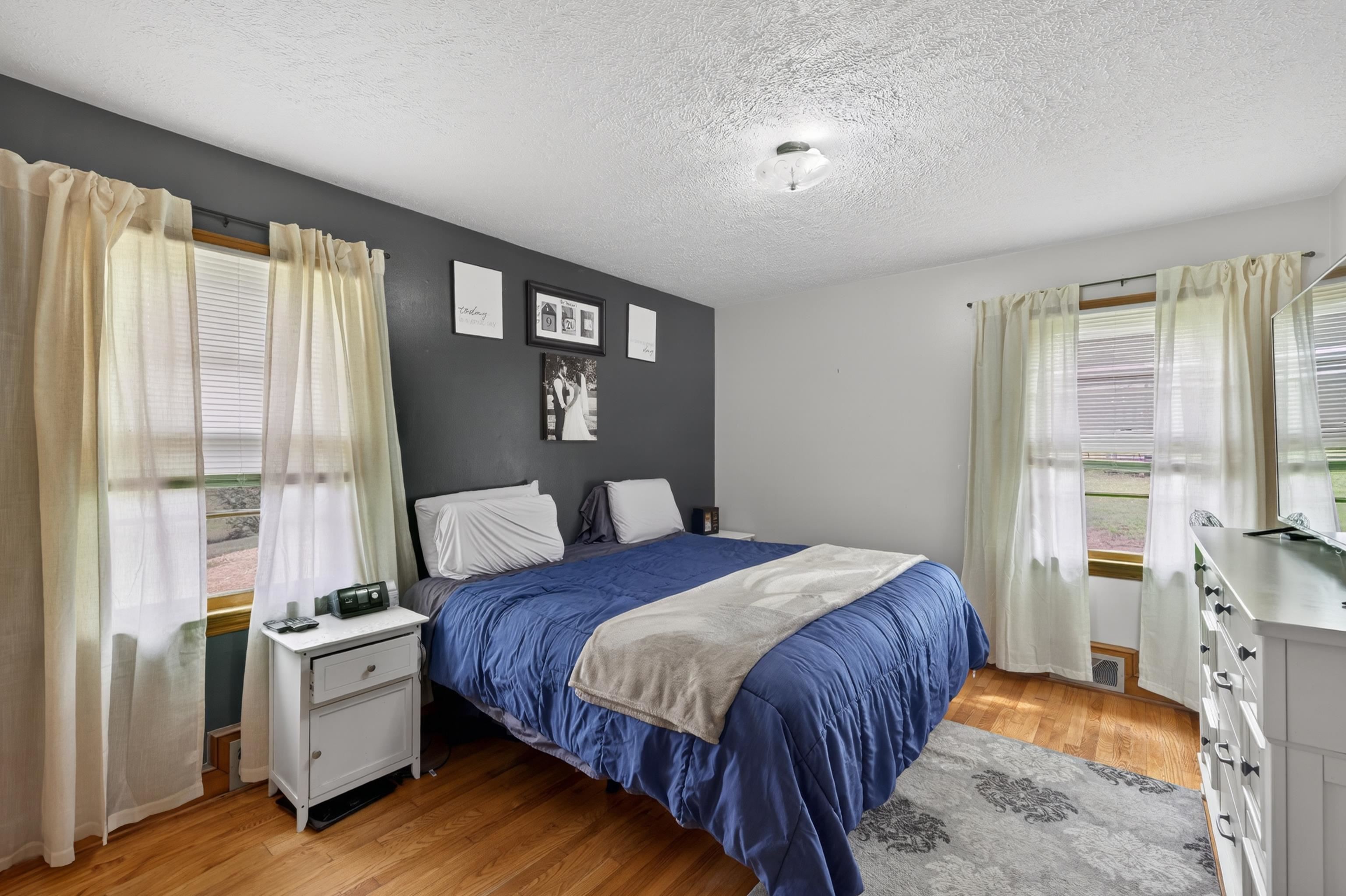 7827 Lee Highway Raphine, VA 24472 - Photo 28 of 62 a bedroom with a bed and a large window