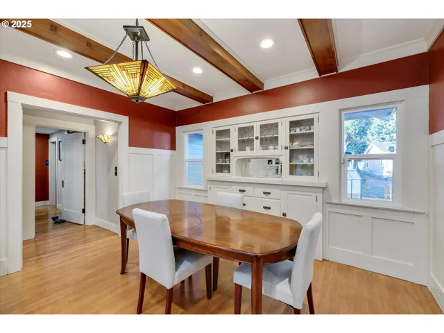 a dinning table and chairs in a room