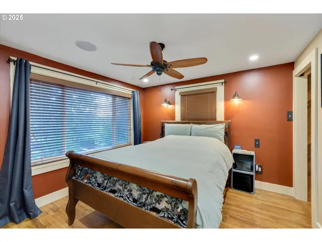 a room with a bed and a chandelier