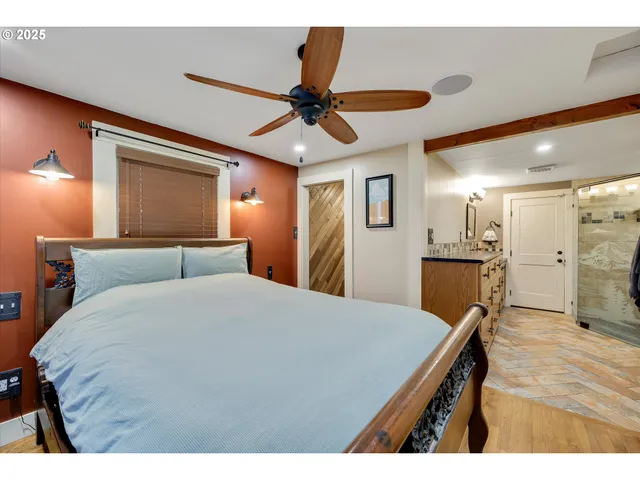 a bed room with a bed and a chandelier