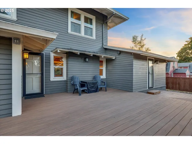 a view of backyard with a table and chairs