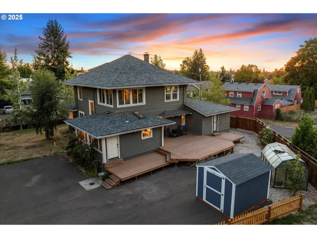 a view of a house with table and chairs