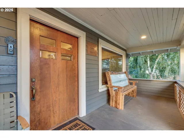 a living room with furniture and large windows