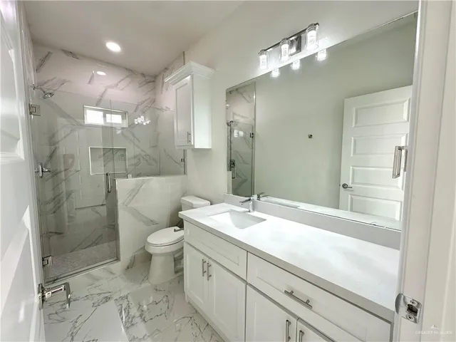 an empty room with a ceiling fan and window