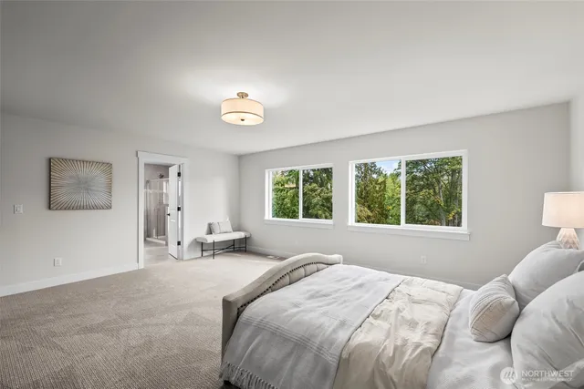a spacious bathroom with a bathtub and shower