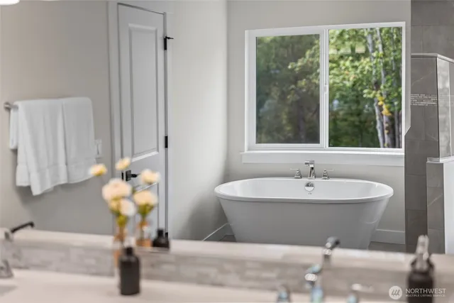 a bedroom with a bed and a lamp