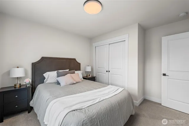 a bathroom with a double vanity sink mirror double and bathtub