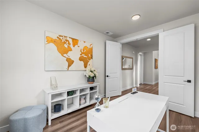 a living room with a furniture and a table