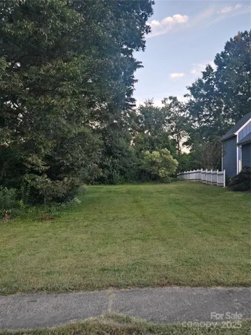 a view of outdoor space with green field and trees