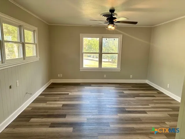 a view of an empty room with a window