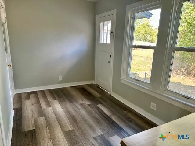 a view of an empty room and window