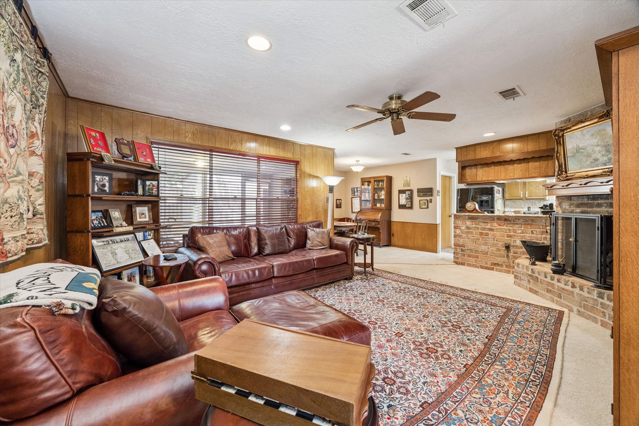3019 Stetson Lane Houston, TX 77043 - Photo 11 of 28 Cozy family room featuring a classic fireplace and ample natural light.