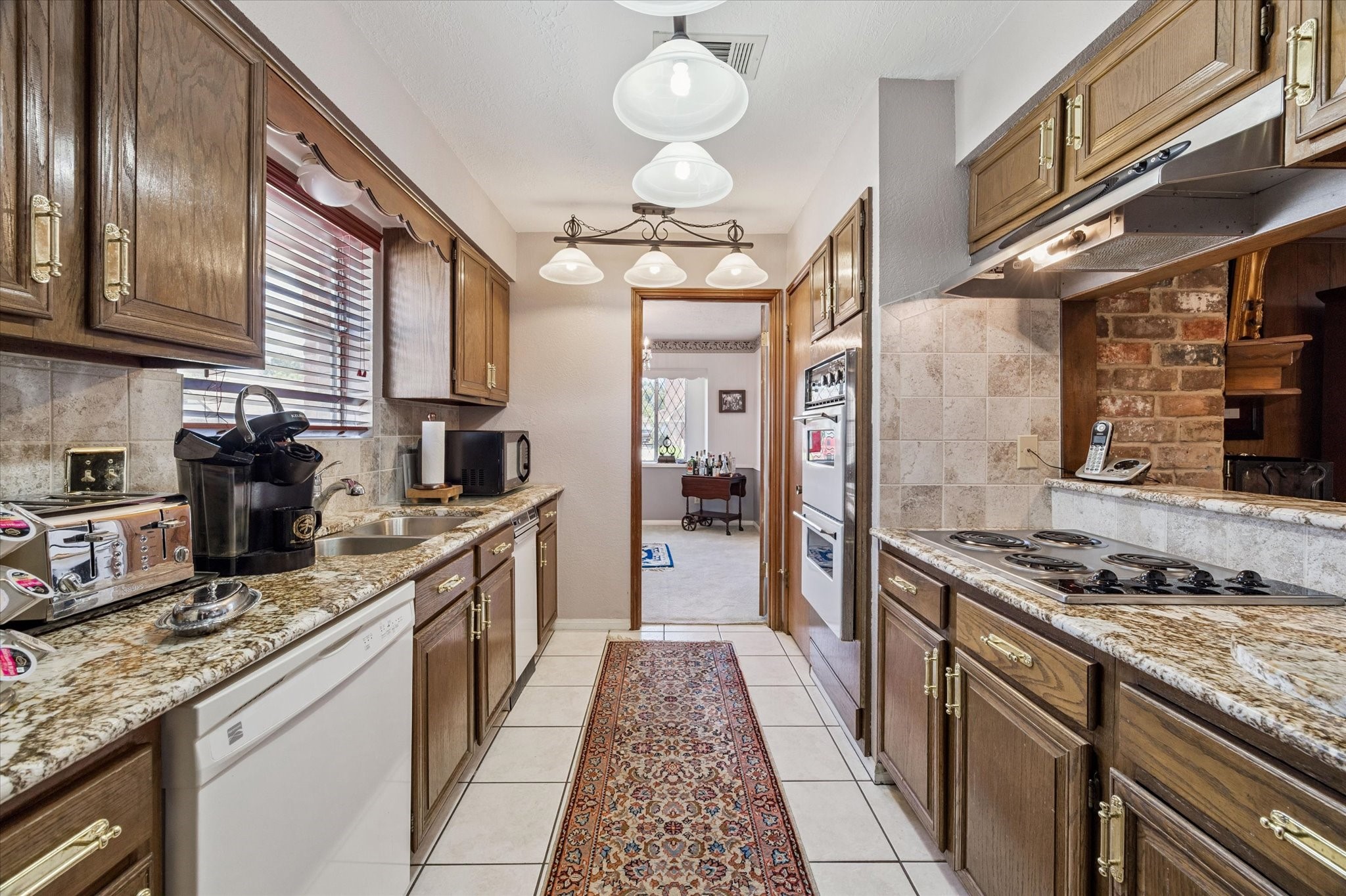 3019 Stetson Lane Houston, TX 77043 - Photo 13 of 28 Inviting kitchen with an open feel, ideal for lively conversations and hearty meals.