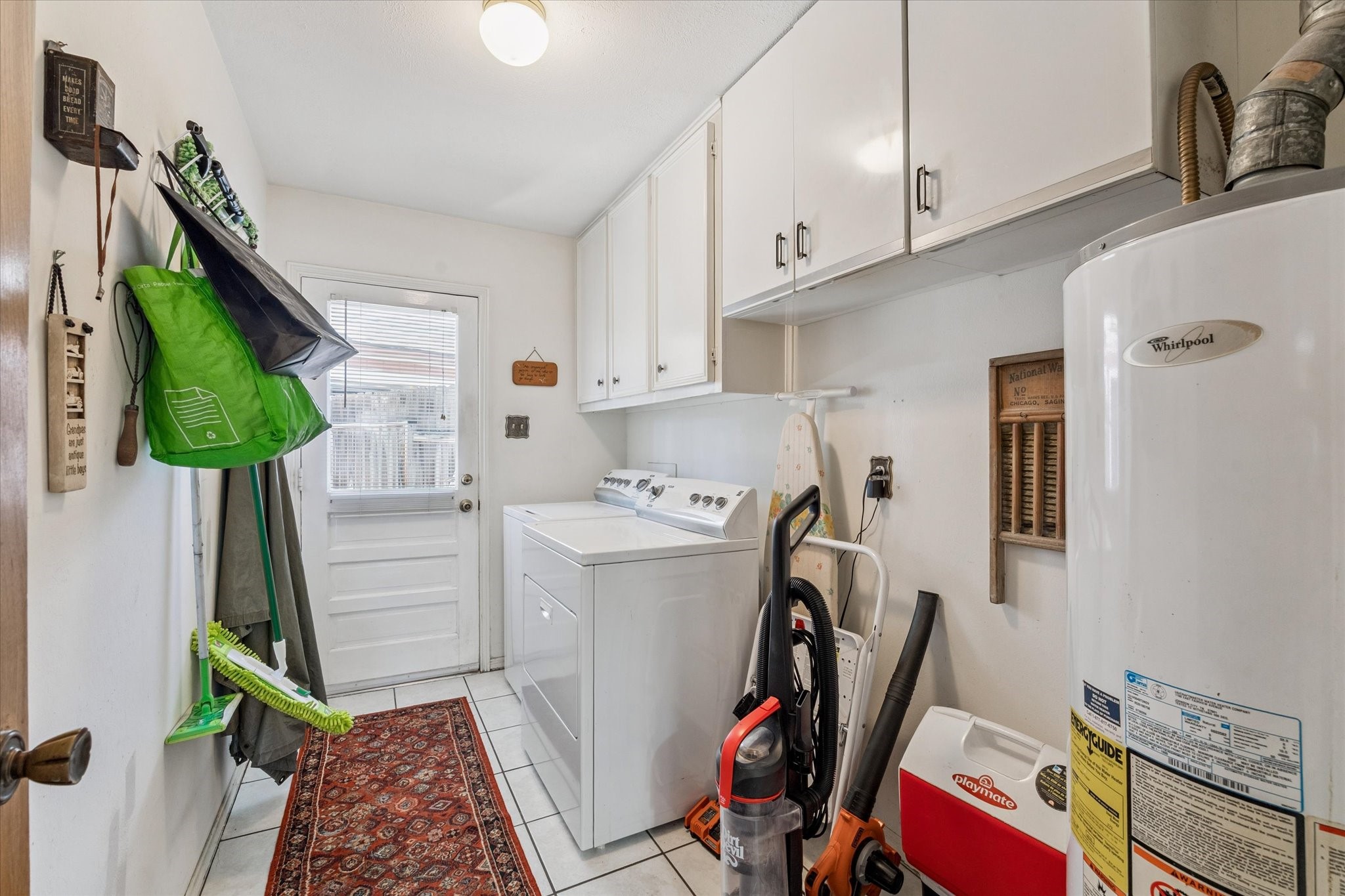 3019 Stetson Lane Houston, TX 77043 - Photo 25 of 28 Practical utility space perfect for laundry and household tasks.