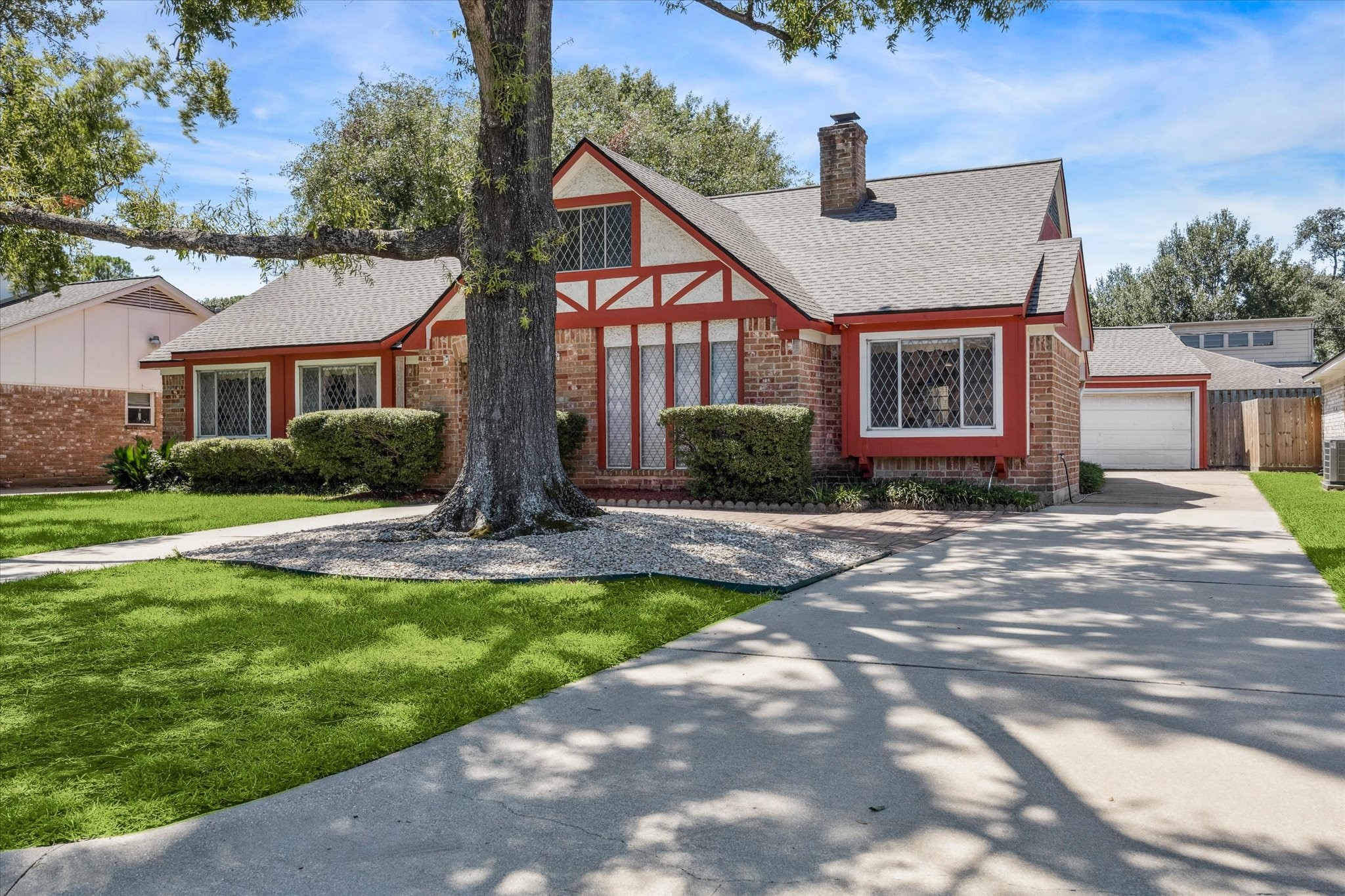 3019 Stetson Lane Houston, TX 77043 - Photo 3 of 28 Beautifully maintained Tudor-style home with unique architectural charm and a large, shaded front yard.